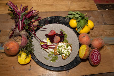 A delicious plate of the vegetarian meal roasted beetroot's goat cheese toasties with pesto dressing...
