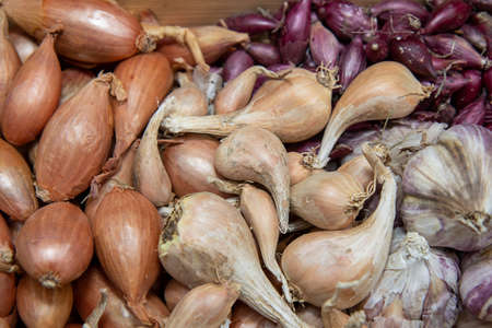 A large basket full of onions