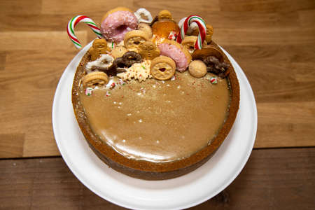A delicious Butterscotch Latte Cheesecake topped with lots of Christmas treats