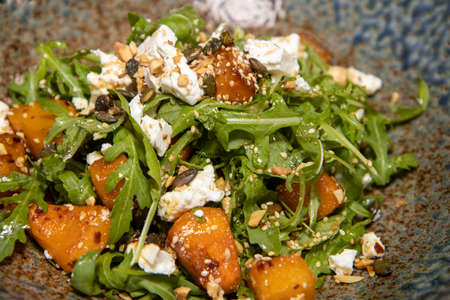 A plate of delicious Maple-Roasted squash and feta cheeseの写真素材