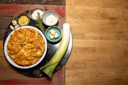A delicious chicken and wild mushroom pie on a wooden tableの写真素材