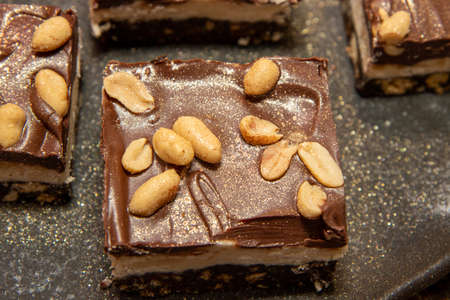 A delicious trey of Salted Peanut Nanaimo Bars, tasty festive Christmas treatsの写真素材