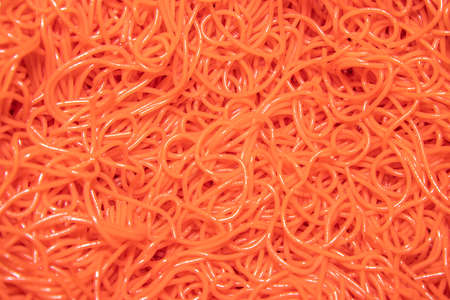 A close up of spaghetti mixed with red food colouring to be used as a Halloween decorationの写真素材