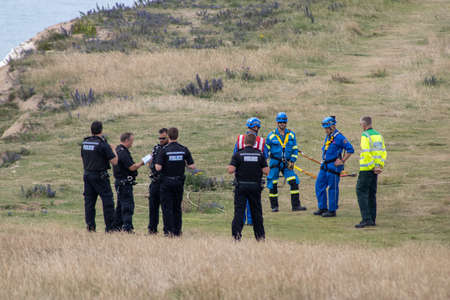 East Sussex, Beachy Head, UK 10th July 2019: Police officer on the cliff tops of Beachy Head...