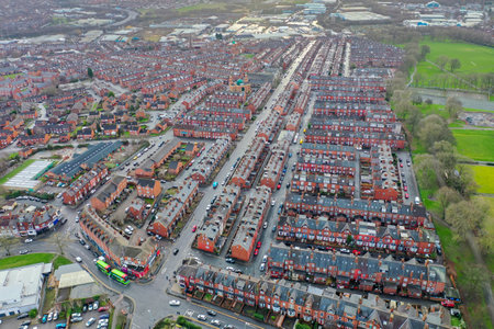 Aerial photo of the village of Beeston in Leeds West Yorkshire showing a typical British park along...
