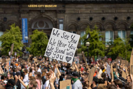 Leeds UK, 14th June 2020: Black lives matter protesters in the Leeds City Centre protesting about Black lives holding up signsのeditorial素材