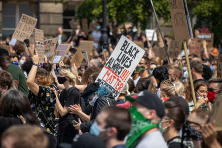 Leeds UK, 14th June 2020: Black lives matter protesters in the Leeds City Centre protesting about Black lives holding up signsのeditorial素材