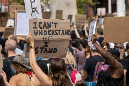 Leeds UK, 14th June 2020: Black lives matter protesters in the Leeds City Centre protesting about Black lives holding up signsのeditorial素材