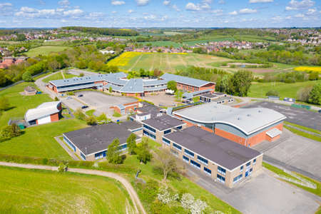 Castleford UK, 29th April 2020: Aerial photo of the Brigshaw High School and School grounds, taken in the village of Castleford in Wakefield West Yorkshire UK on a sunny summers day with clouds.のeditorial素材