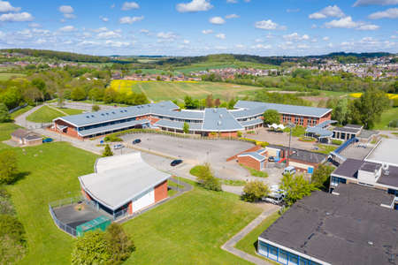 Castleford UK, 29th April 2020: Aerial photo of the Brigshaw High School and School grounds, taken in the village of Castleford in Wakefield West Yorkshire UK on a sunny summers day with clouds.のeditorial素材