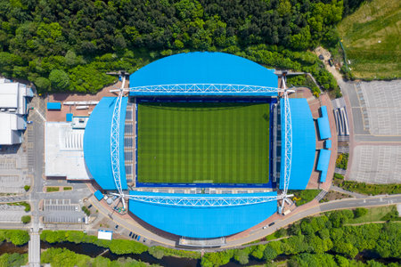 Aerial photo of The John Smith's Stadium home of the Huddersfield Town Football Club and the town centre of Huddersfield Borough of Kirklees in West Yorkshire Britainのeditorial素材