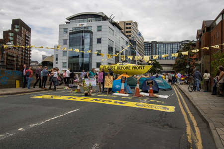 Leeds UK, 18th July 2019: The Extinction Rebellion Protest located in the Leeds City Centre on Victoria Bridge showing people holding signs about the protest.のeditorial素材