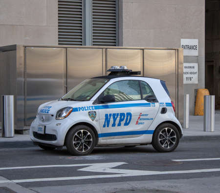 New York USA, 8th April 2019: A United States of America Police car Small Smart Car traveling on a road in New York Cityのeditorial素材