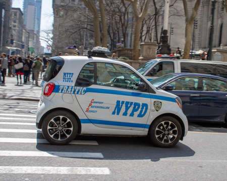 New York USA, 8th April 2019: A United States of America Police car Small Smart Car traveling on a road in New York Cityのeditorial素材