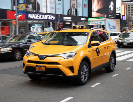 New York USA, 7th August 2019: A United States of America yellow Taxi traveling on a road in New York Cityのeditorial素材