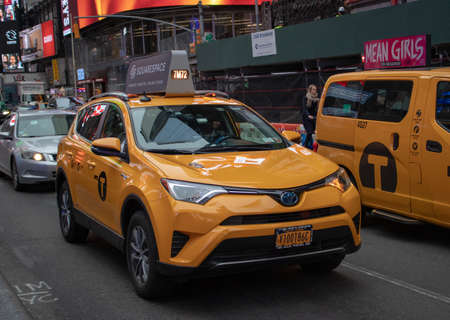 New York USA, 7th August 2019: A United States of America yellow Taxi traveling on a road in New York Cityのeditorial素材