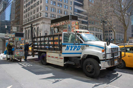 New York USA, 8th April 2019: A United States of America police truck taking away a street venders equipment in Manhattanのeditorial素材
