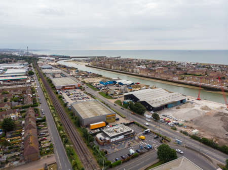 Aerial photo of the town of Shoreham-by-Sea, a seaside town and port in West Sussex, England UK, showing typical housing estates and businesses taken on a bright sunny day.のeditorial素材