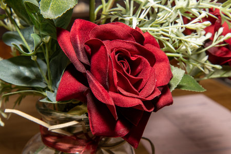 A close up photo of a silk rose valentines day love conceptの写真素材