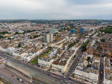 Aerial photo of the Brighton and Hove town centre showing hotels, guest houses, local businesses and the roads and streets of the town centre, taken on a bright sunny day with a drone over the town.のeditorial素材