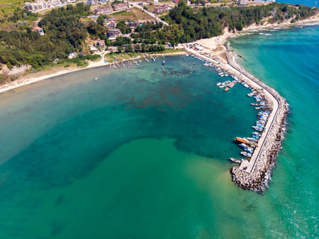 Aerial photo of the beautiful small town and seaside resort of Obzor in Bulgaria showing the fishing and marina side of the town showing fishing boats and the small sunny beachのeditorial素材