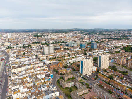 Aerial photo of the Brighton and Hove town centre showing hotels, guest houses, local businesses and the roads and streets of the town centre, taken on a bright sunny day with a drone over the town.のeditorial素材