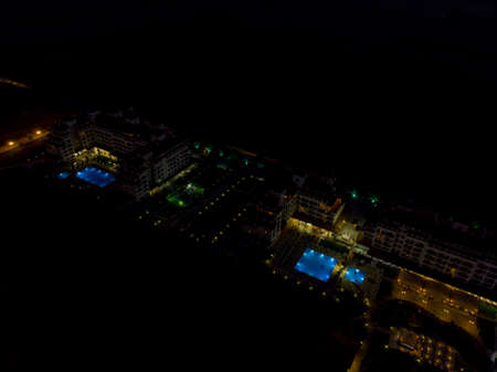 Aerial night time photo of hotels and sea front of the beautiful small town and seaside resort known as Obzor in Bulgariaのeditorial素材