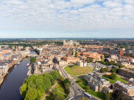 Aerial photo of the town of York located in North East England and founded by the ancient Romans, the photo shows The Minster Historical Cathedral and the main town centre along the river.のeditorial素材