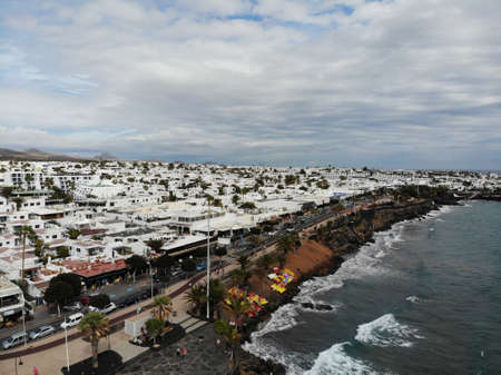 Aerial photo of the beautiful beach at Lanzarote in Spain one of the Canary islands, showing the beautiful beach with hotels and houses in the backgroundのeditorial素材