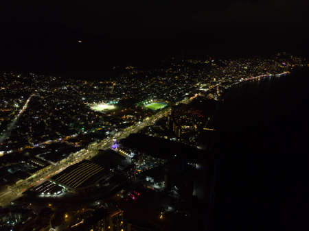 Night time aerial photo of the beautiful town of Puerto Vallarta in Mexico, the town is on the Pacific coast in the state known as Jalisco, Mexican town.のeditorial素材