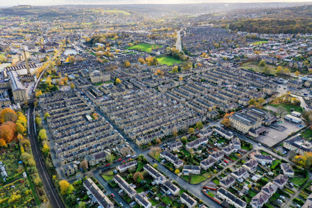 Aerial photo taken in the small town of Shipley in the City of Bradford, West Yorkshire, England showing the autumn fall colours of the hosing estates and roads in the town centre.のeditorial素材