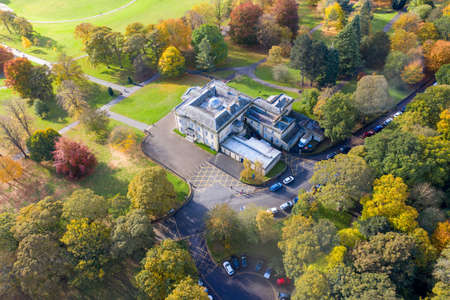 A beautiful aerial photo in the autumn fall at the park in Leeds West Yorkshire known as Roundhay Park showing the brown and green colours on the treesのeditorial素材