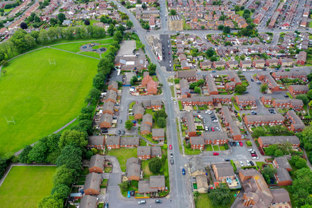 Aerial photo of the village of Pudsey in Leeds West Yorkshire showing a typical British housing estate taken on a hot sunny day in the summer timeのeditorial素材