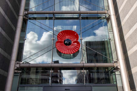 A large memorial poppy placed on the Leeds Royal Armouries museum in the Leeds city centreのeditorial素材