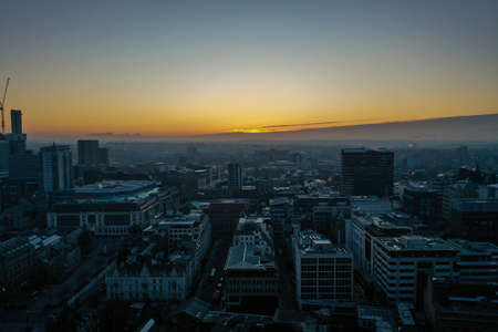 Aerial photo of a beautiful sunrise rising over the town of Leeds in West Yorkshire UK.