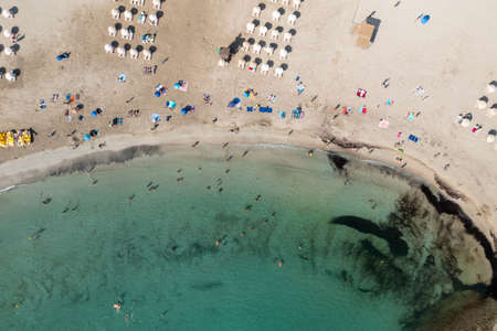 Top down aerial photo of the Spanish island of Ibiza showing the beautiful beach front on and the...