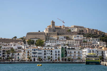 The beautiful island of Ibiza showing homes and apartments by the coastの写真素材