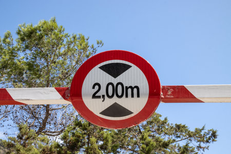 A traffic sign saying 2,00m high that has been hit by a large van in the pastの写真素材