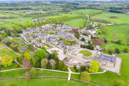 Aerial photo of the small village of Ripley in Harrogate, North Yorkshire in the UK showing the historical British Ripley Castle Wedding Venue and old stones cottages in the small villageのeditorial素材