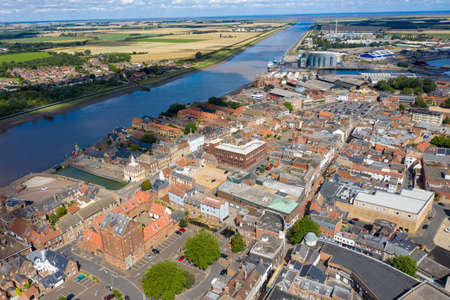 Aerial photo of the beautiful town of King's Lynn a seaport and market town in Norfolk, England UK showing the main town centre along side the River Great Ouse on a sunny summers dayのeditorial素材