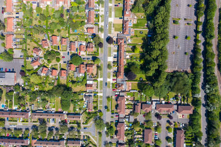 Top down aerial footage of the suburban houses and village of Welwyn Garden City in Hertfordshire taken on a hot sunny summers day showing a straight down view of the typical British housing estatesのeditorial素材