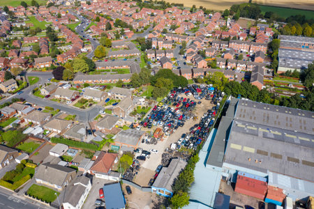 Aerial photo of the British town of Ossett, a market town of the City of Wakefield, West Yorkshire, England showing a typical UK housing estate and scrap yardのeditorial素材