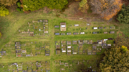 Aerial photo of the the town of Woodthorpe, it's a suburb in the south west of the city of York, North Yorkshire, England showing an aerial view of a grave yard cemetery in the autumn time.の写真素材