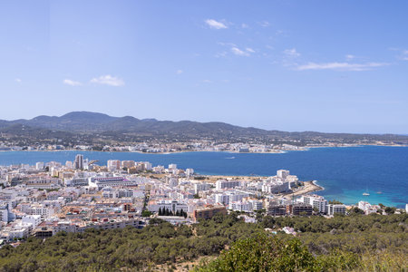 Photo of the town of Sant Antoni de Portmany on the west coast of Ibiza, one of Spainâs Balearic Islands, showing the ocean front by the hotels in the town centre in the summer time.の写真素材