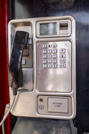 Photo of an old red British public telephone box taken in the beautiful town of Middleham in Leyburn in North Yorkshire in the UKの写真素材