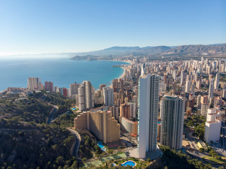 Aerial photo taken in Benidorm in Spain Alicante, showing the beautiful beach of Playa Levante and hotels, buildings, and high rise skyline cityscape.の写真素材