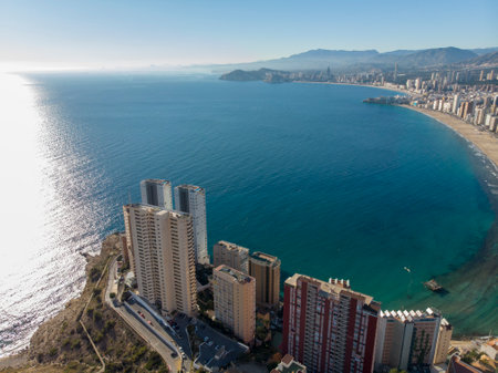 Aerial photo taken in Benidorm in Spain Alicante, showing the beautiful beach of Playa Levante and hotels, buildings, and high rise skyline cityscape.の写真素材