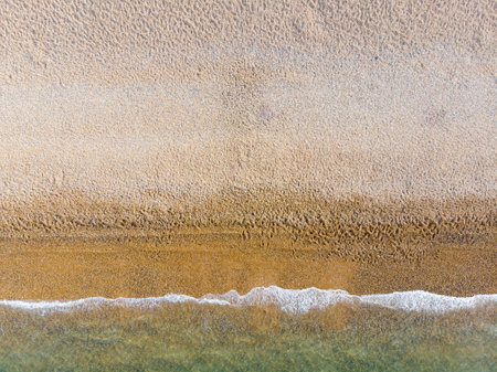 Aerial photo of the beautiful Brighton beach, located in the south coast of England UK that is part of the City of Brighton and Hove, taken on a bright sunny day showing the ocean and beach.の写真素材