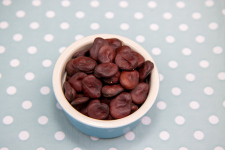 A bowl of Red Epicure Broad Bean on a kitchen table ready to be cooked in a dish