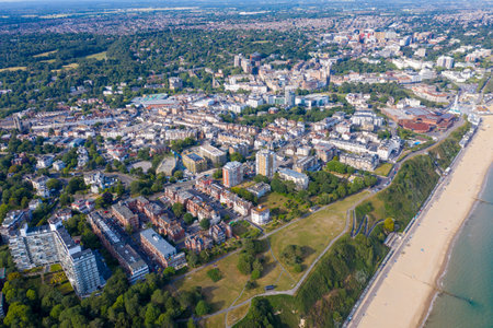 Aerial drone photo of the Bournemouth beach and town centre on a beautiful sunny day showing beach front hotels, guest houses and home by the seaの写真素材